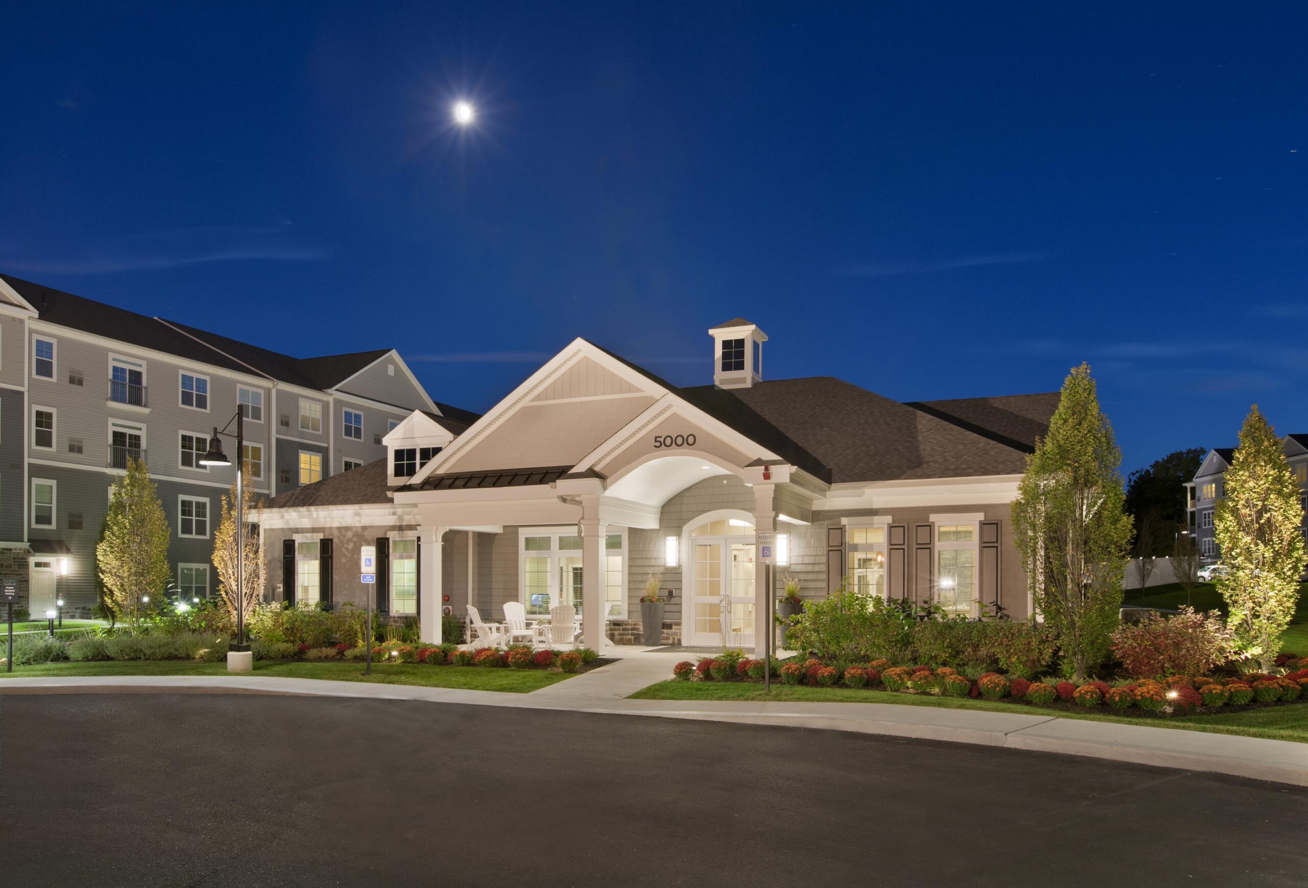 Entrance to clubhouse at Parc Westborough at dusk