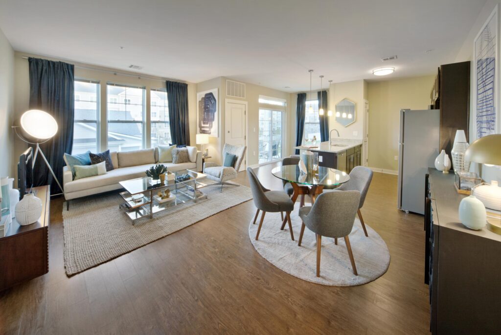 Living and dining areas with kitchen island in background at Parc Westborough