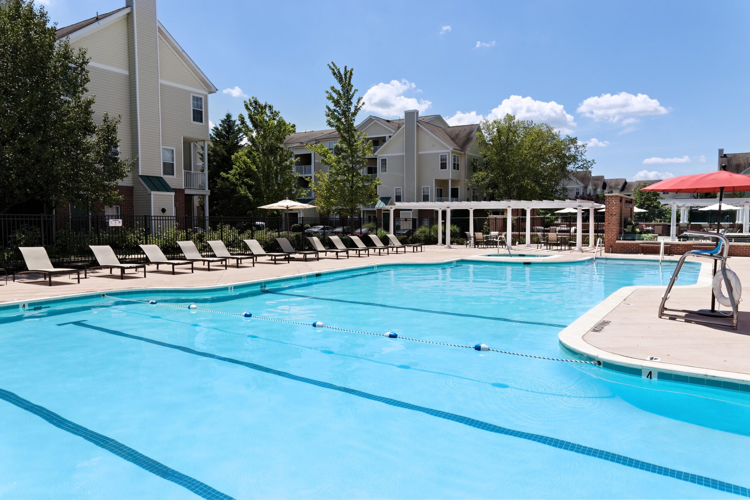 Pool, lounge chairs and pergolas at Dulles Greene