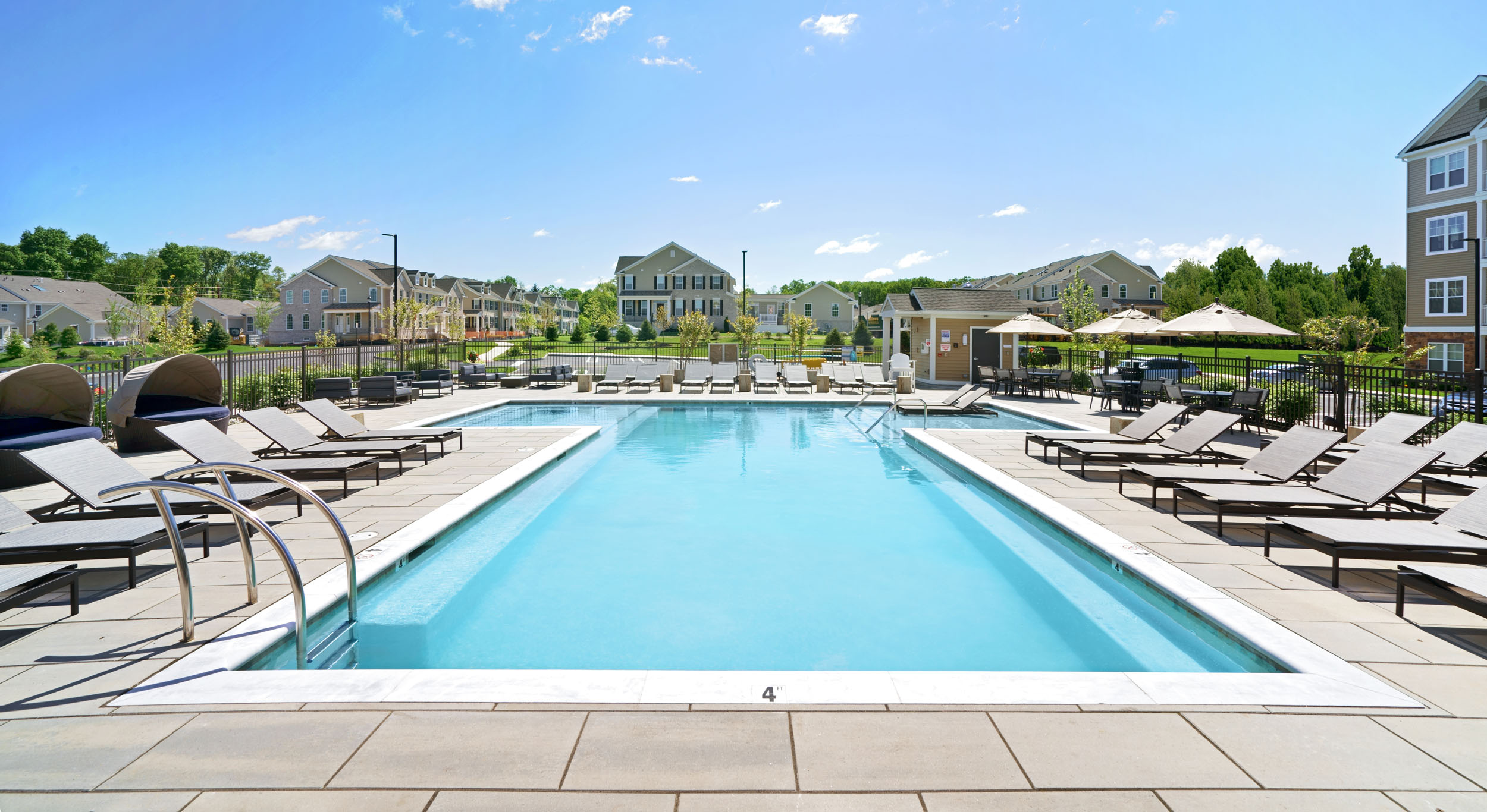 Pool and outdoor lounge area at Parc at Princeton Junction