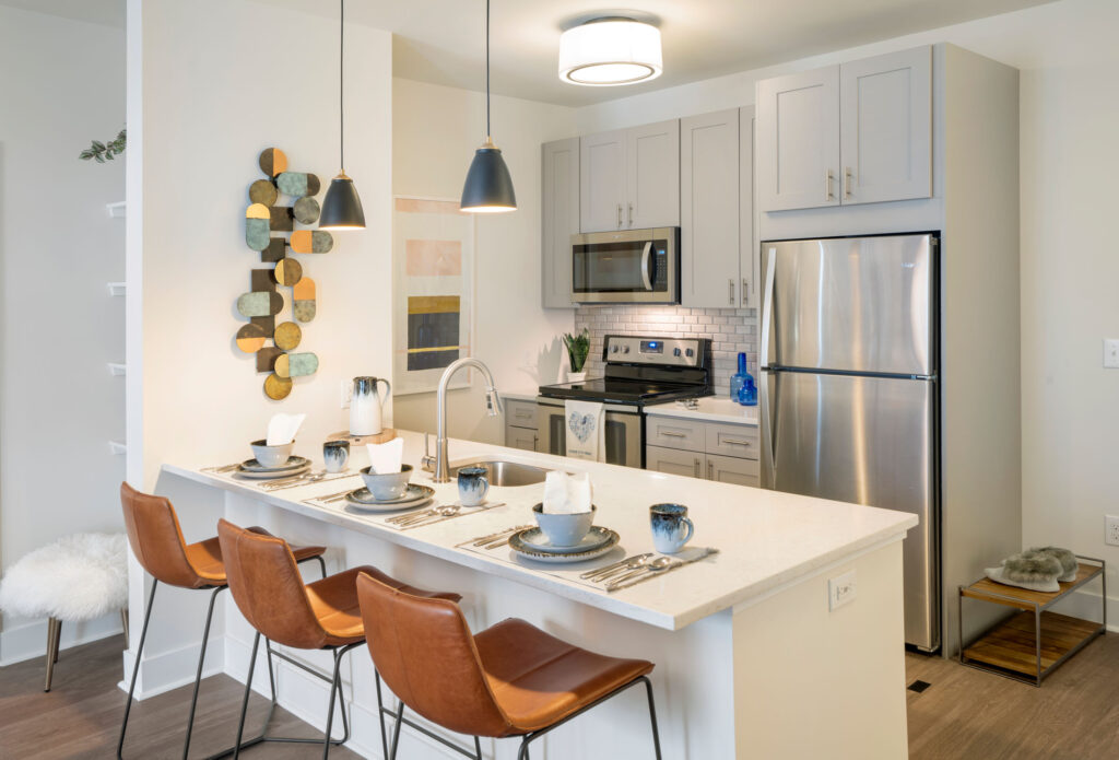 Model kitchen with counter seating at Parc at Princeton Junction