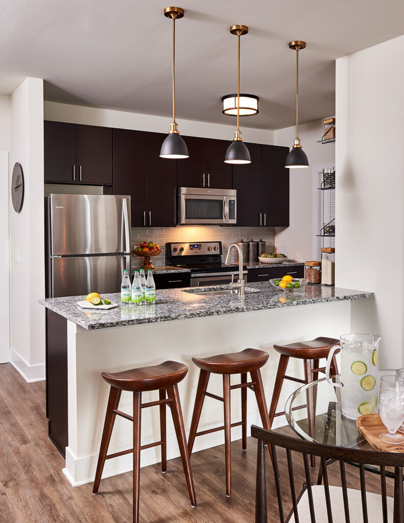 Model kitchen with counter seating at Riverworks