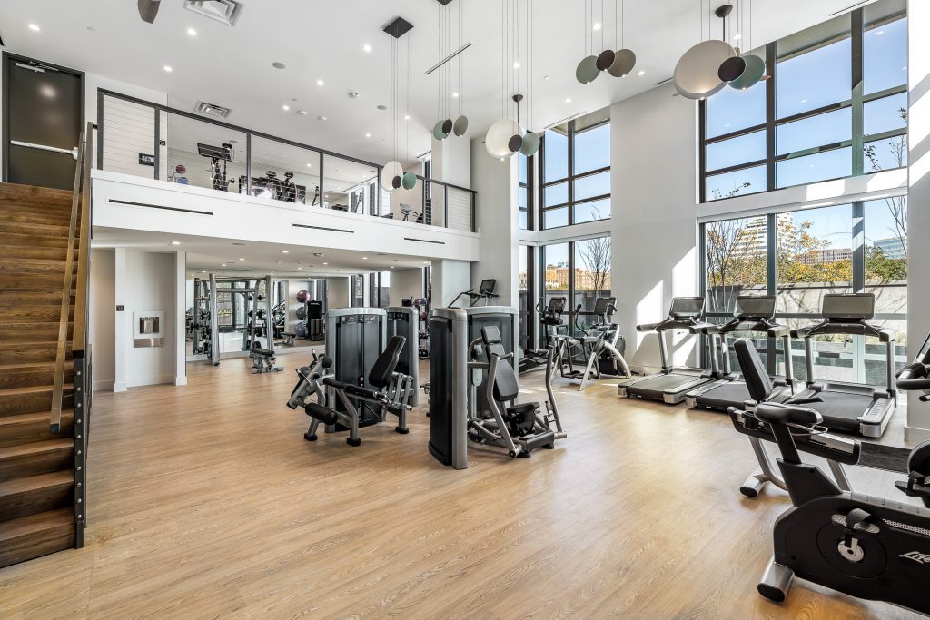 First floor fitness center featuring cardio and weight machines