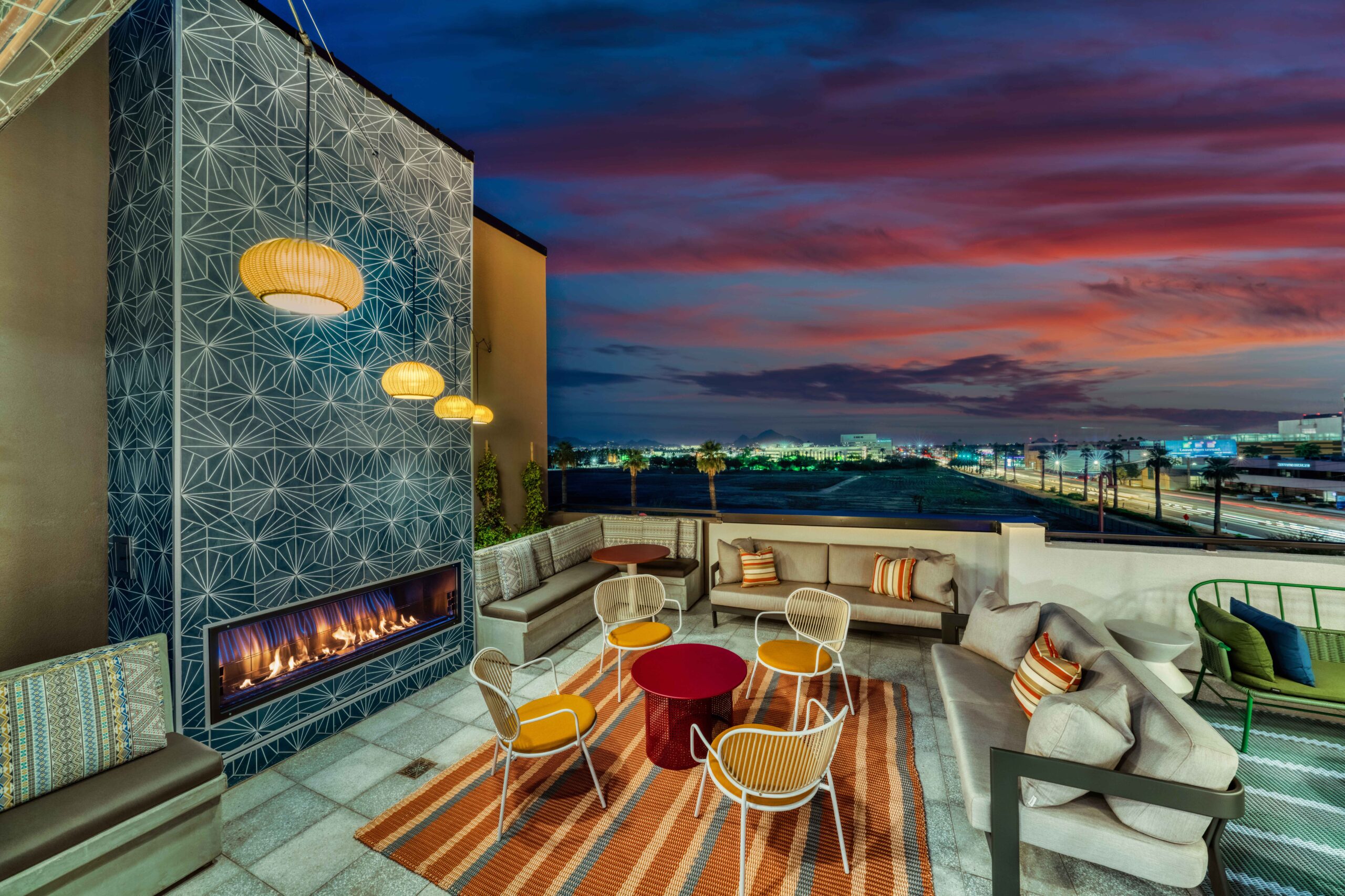 Rooftop lounge with fireplace at Callia at dusk