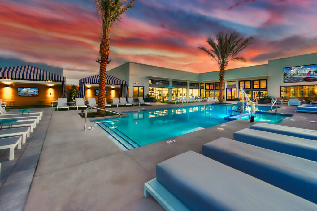 Pool and lounge chairs at Canvas at dusk