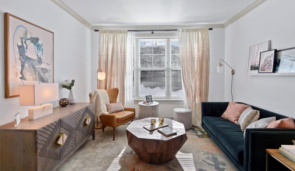 Couch, chair and octagonal coffee table in living room at Carraway