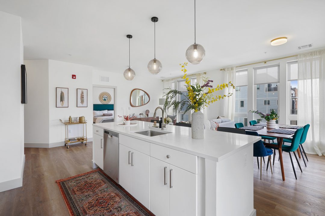 Kitchen island with dining table in background at Emerson