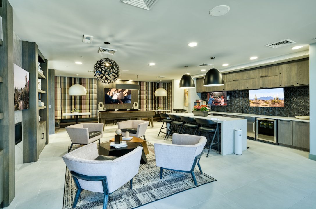 Chairs and bar seating in lounge area at Haverly