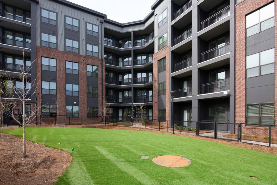 Exterior view of Notion showing green space and balconies