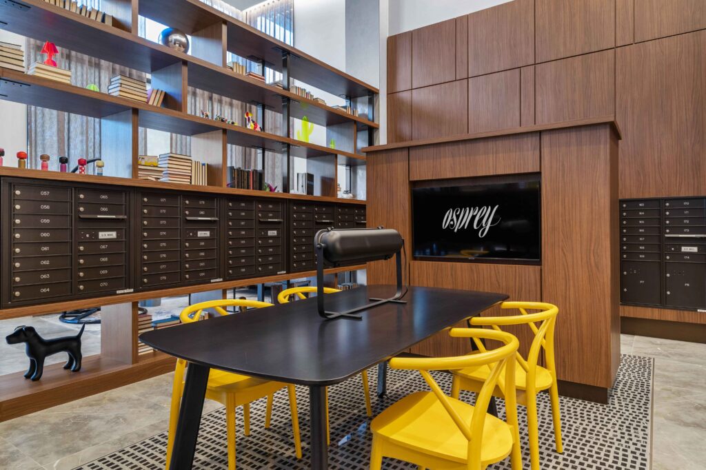 Table with yellow chairs in lobby at Osprey