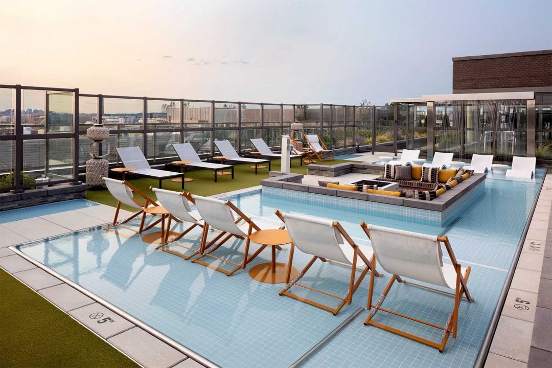 Pool and lounge chairs at Parc Riverside