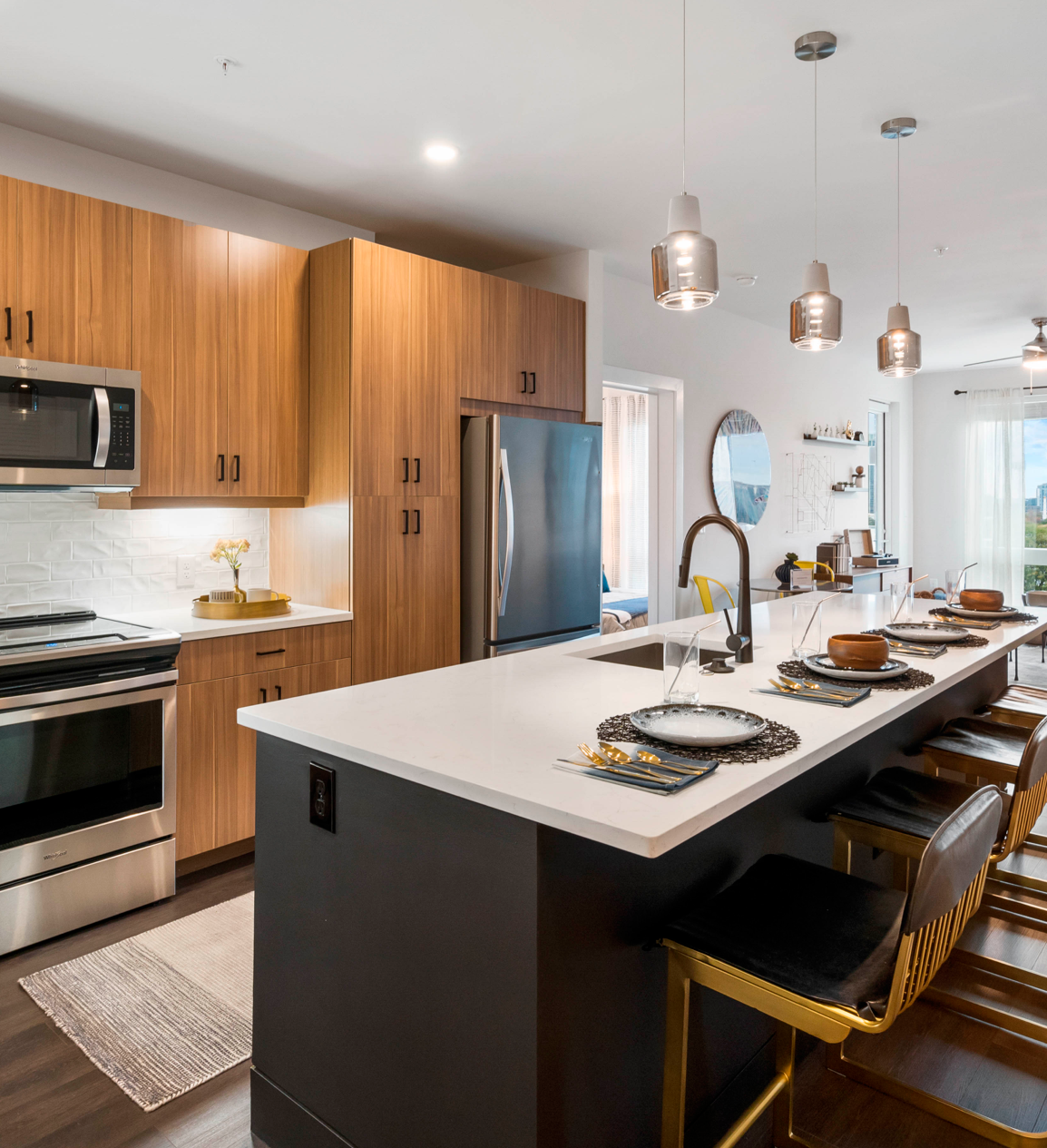 Island seating in modern kitchen with brown cabinets