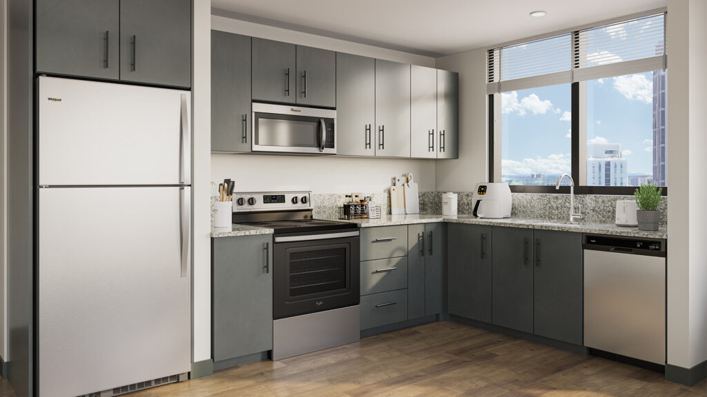 Kitchen with gray cabinets and countertops, stainless steels applicances, and windows.