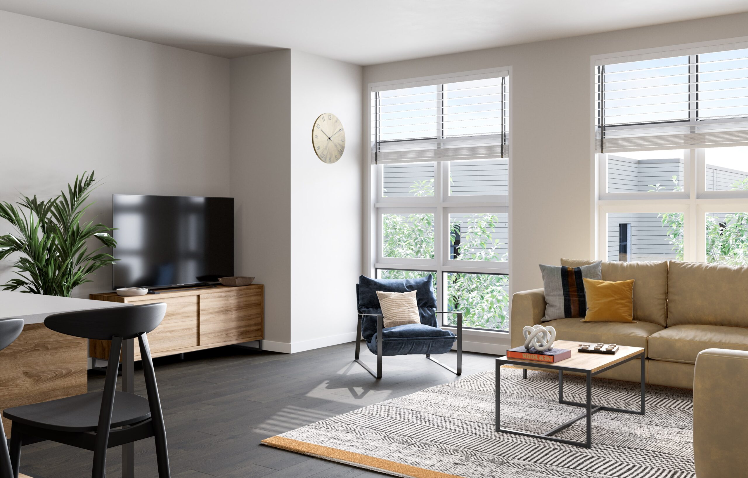 Living room at The 87 with couch, chair and flat screen TV